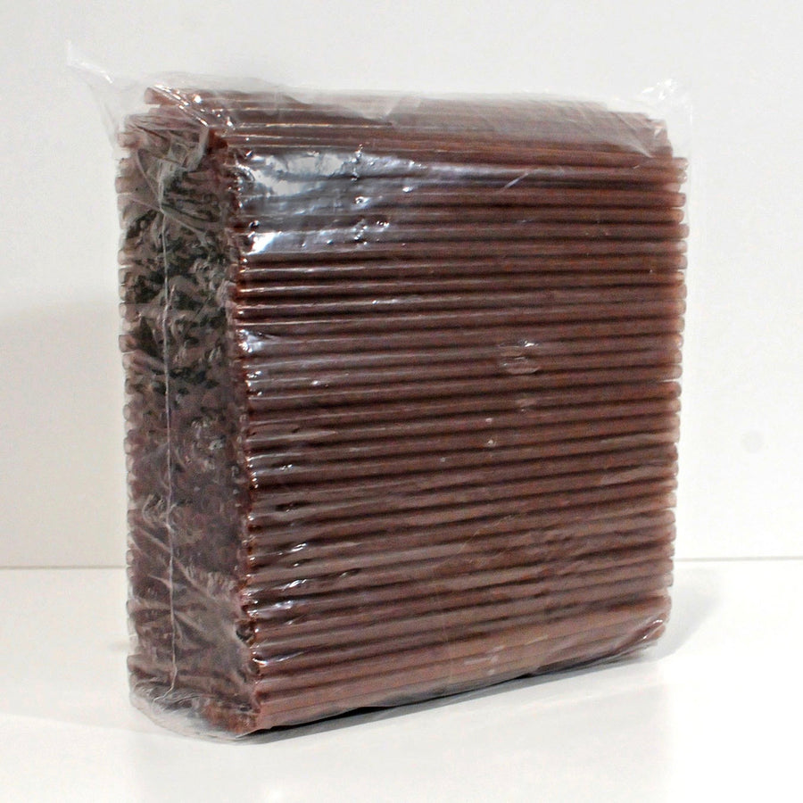 An extreme closeup of an unboxed stack of agave straws